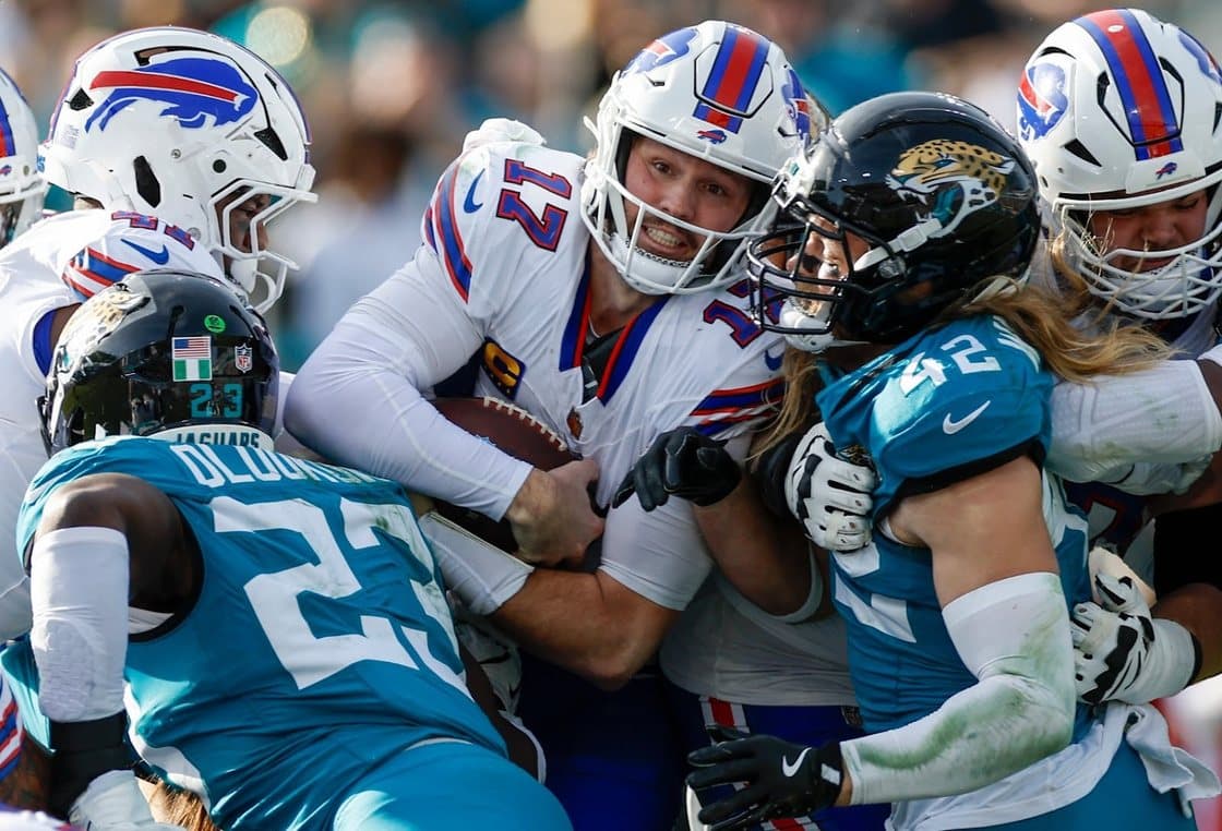 Buffalo Bills and Jacksonville players piled together after a tackle