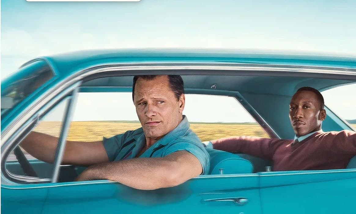 Two men in a turquoise car, from the film Green Book