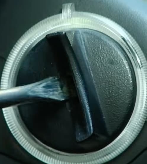 A screwdriver jammed into a car's ignition keyhole