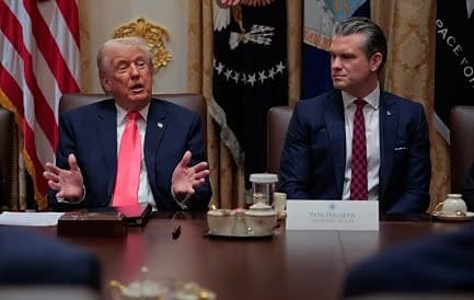 President Trump and Secretary of Defense Pete Hegseth seated at a meeting table